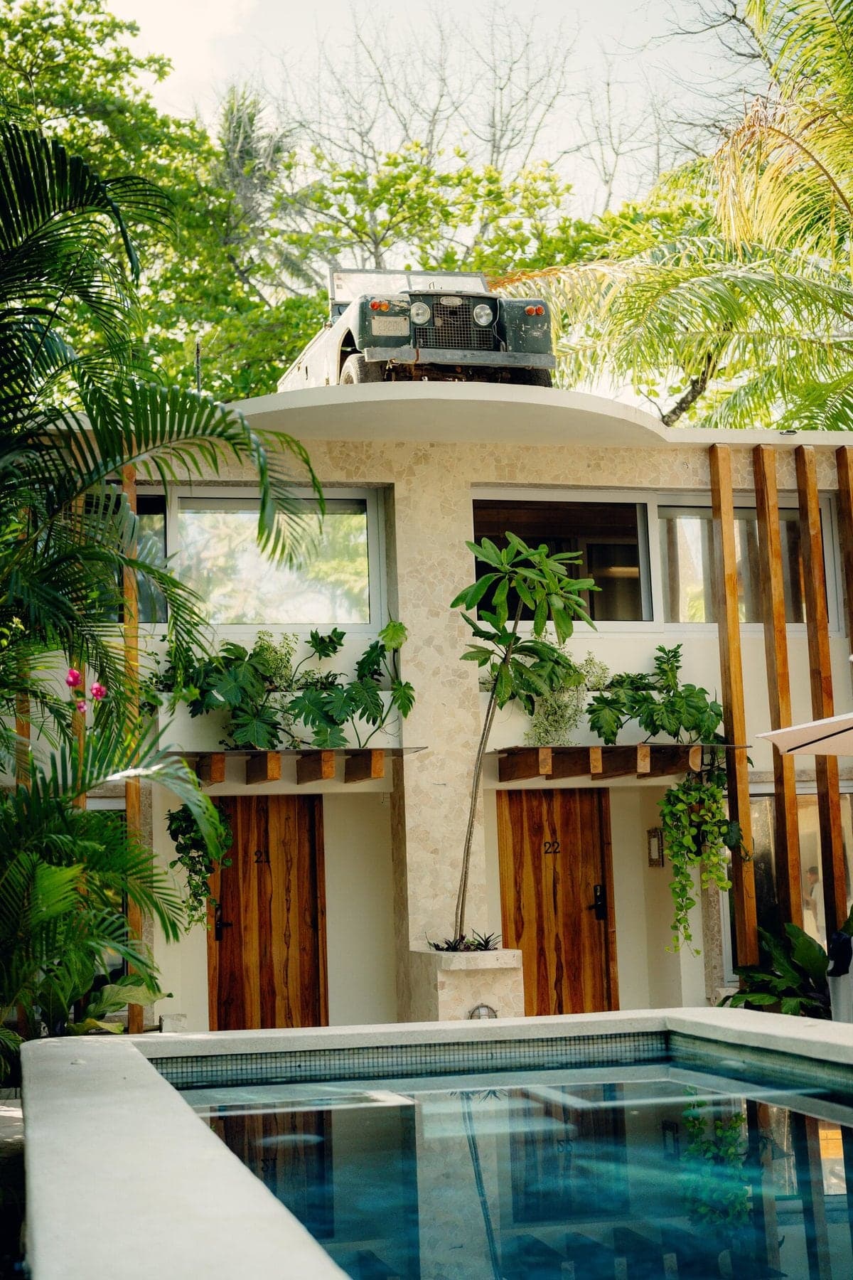 The iconic rooftop Land Rover and pool